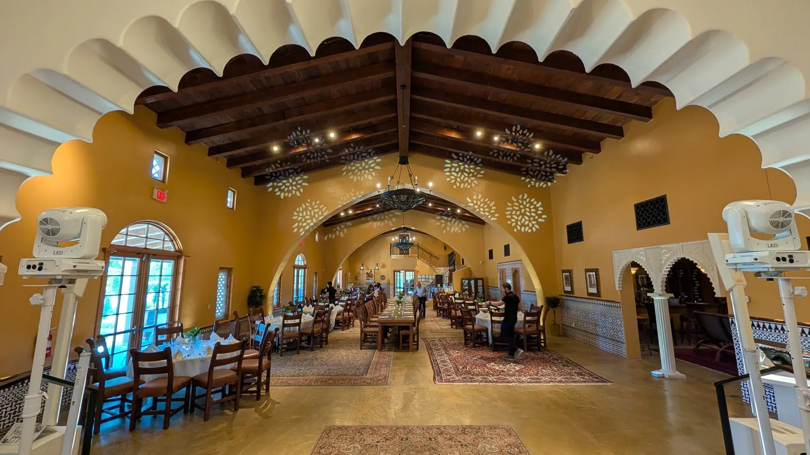 A Cutmaster Music reception setup inside Animante de Rondeña at Casa Rondeña Winery, under a vaulted, scalloped-arch ceiling