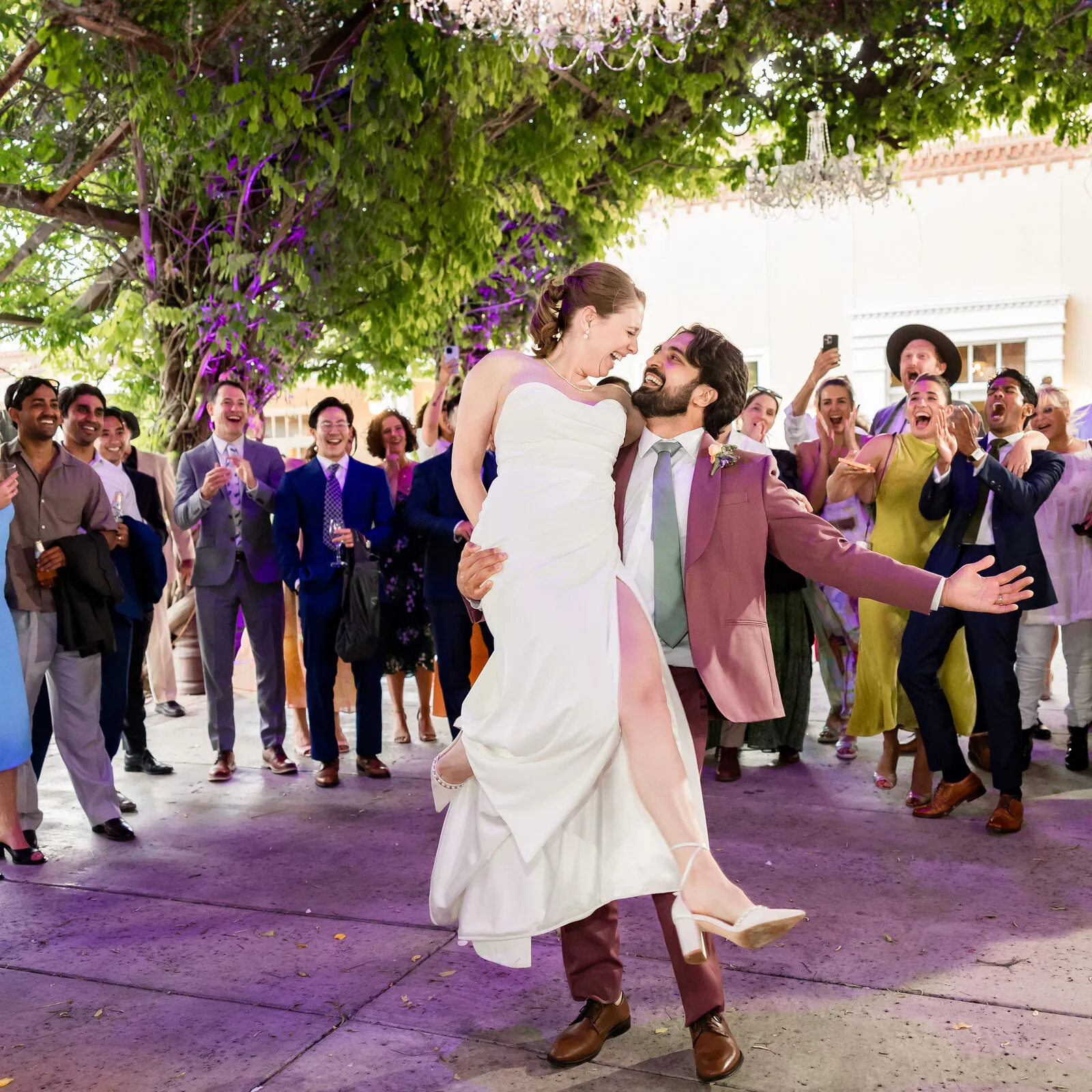 A couple celebrating on the dance floor at their Albuquerque wedding