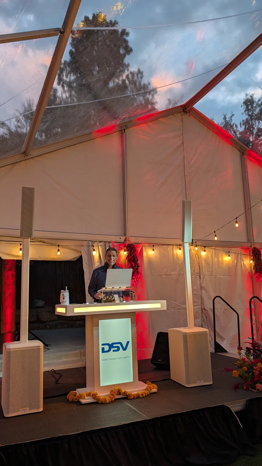 An En Blanc setup branded for a private corporate event under a clear-top tent