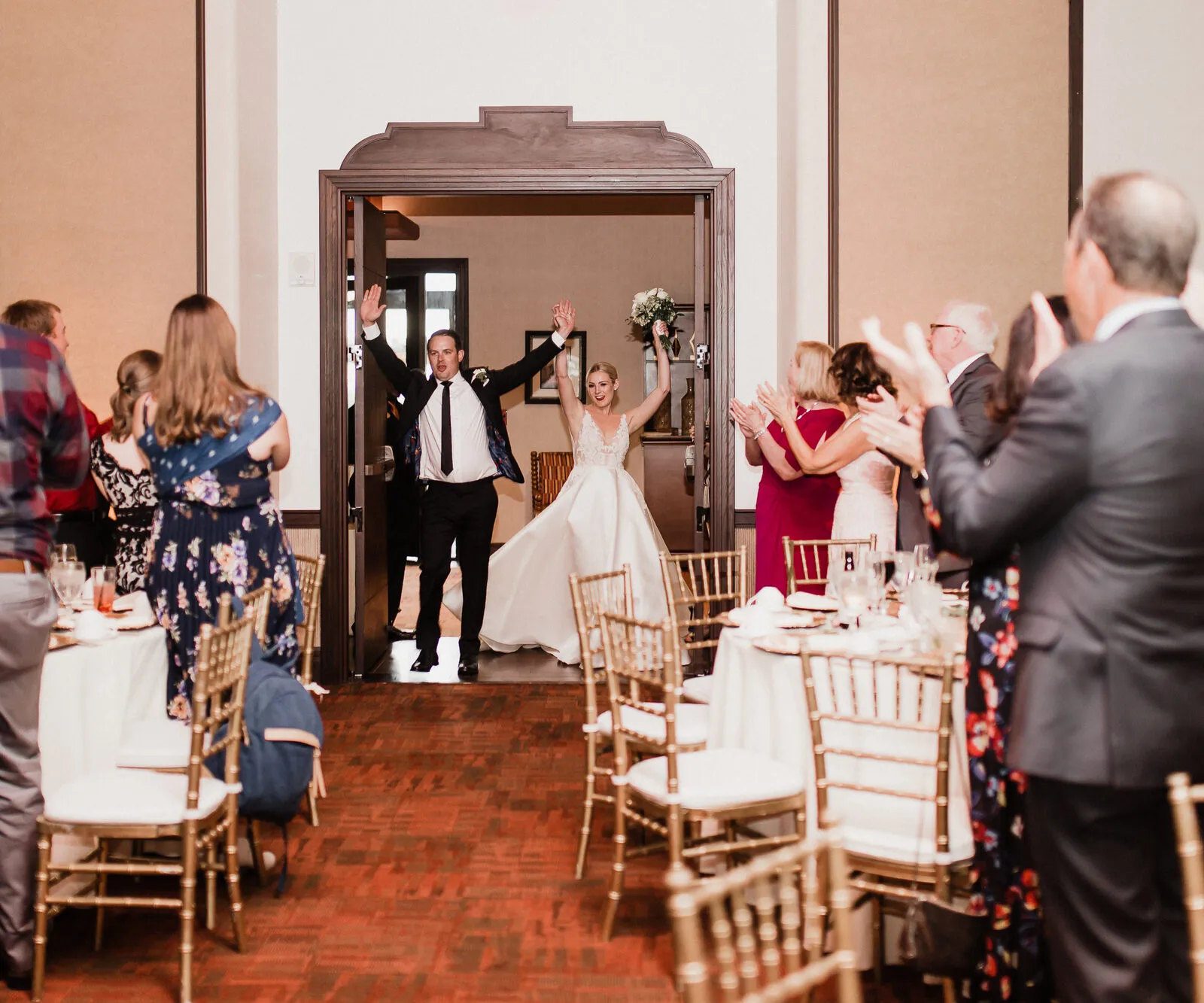 A couple's grand entrance at their New Mexico wedding reception