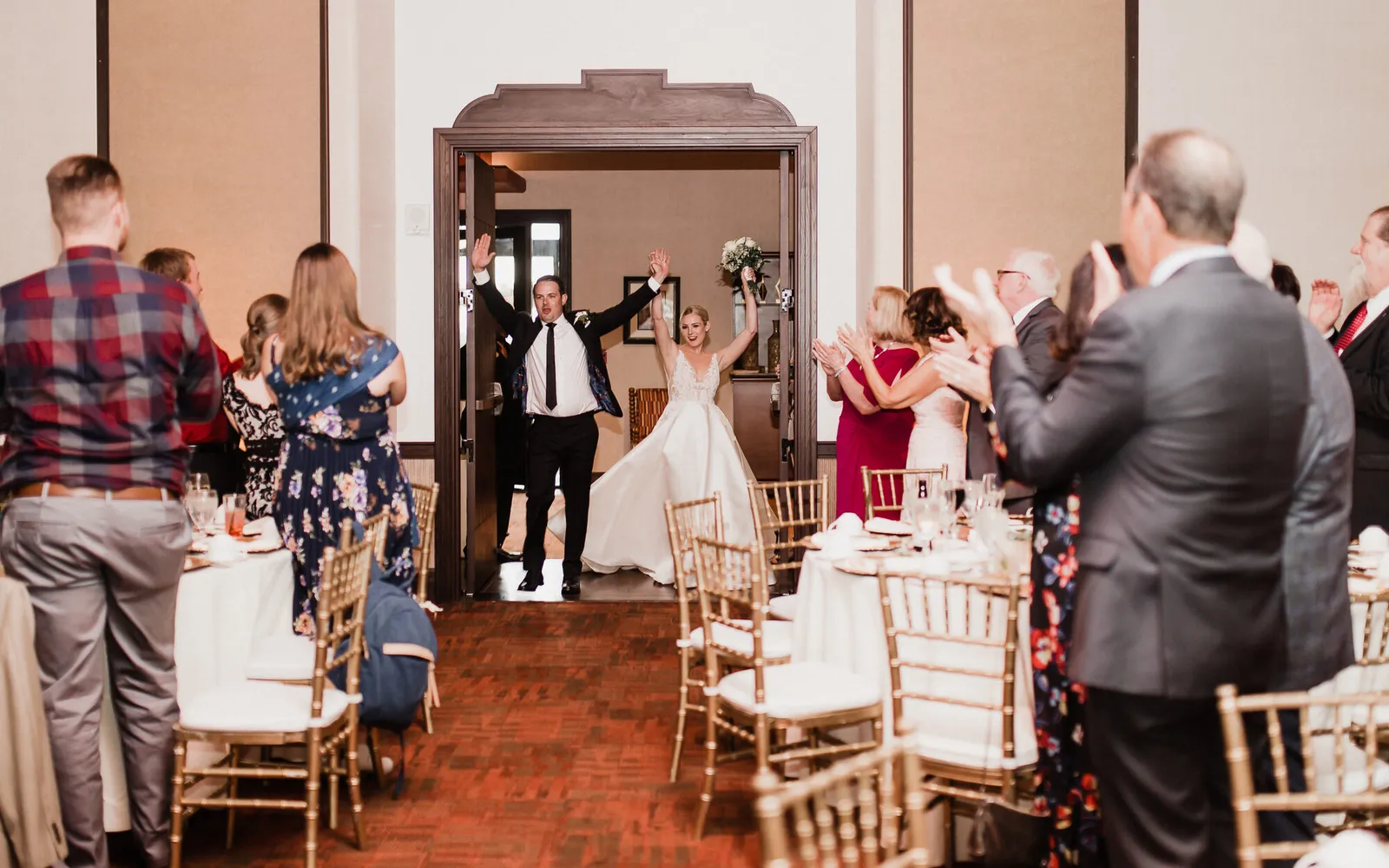 A couple's grand entrance into their wedding reception