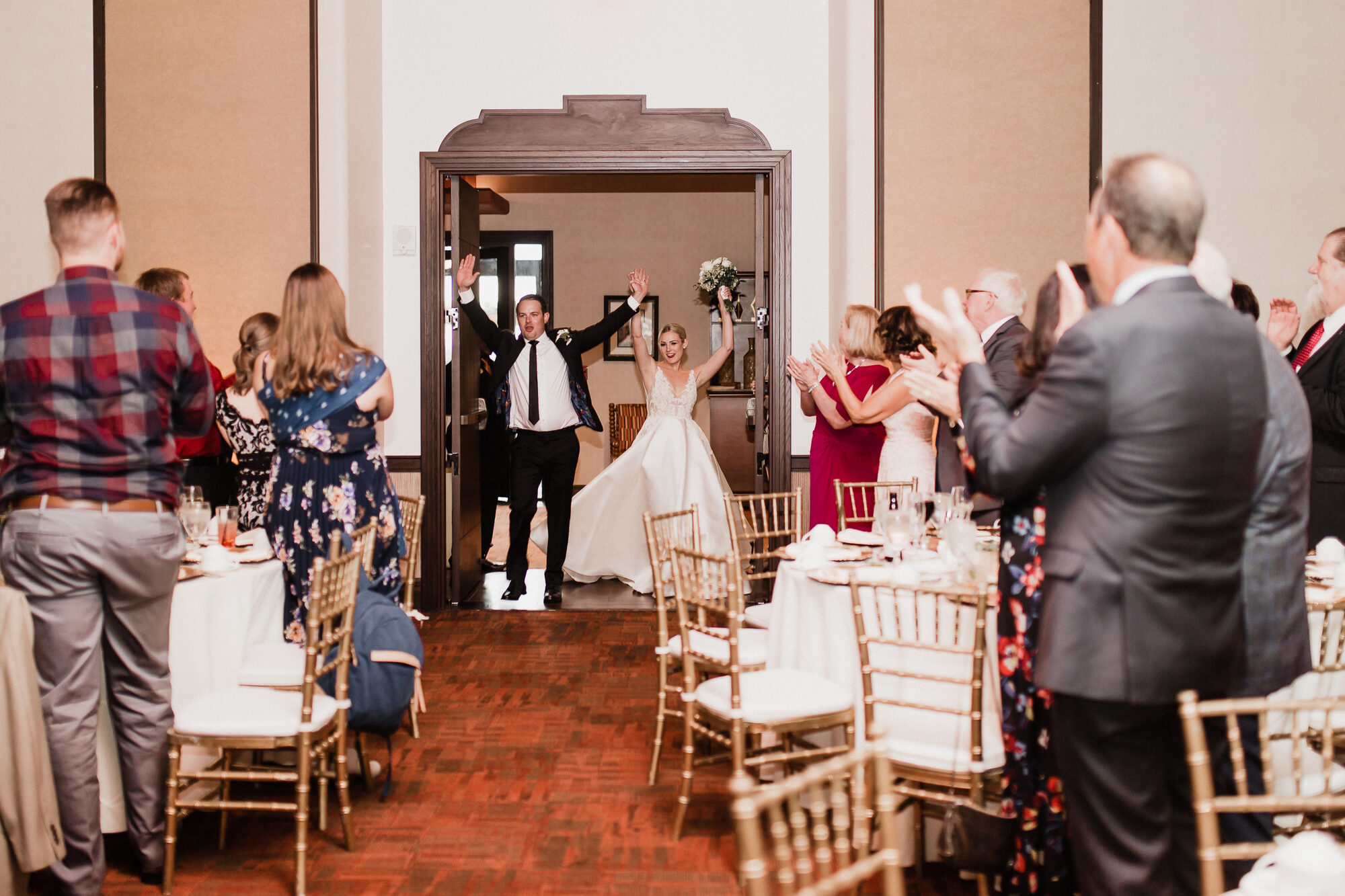 A couple's grand entrance into their reception